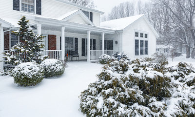 Home with porch fresh snowfall